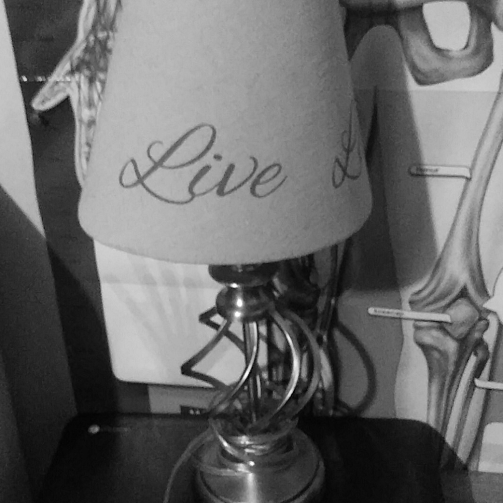 A lamp a phone case and a camera holder